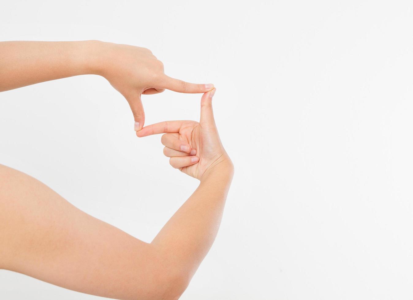 Female hands framing comosition. Isolated on white background. Copy space. Mock up. photo