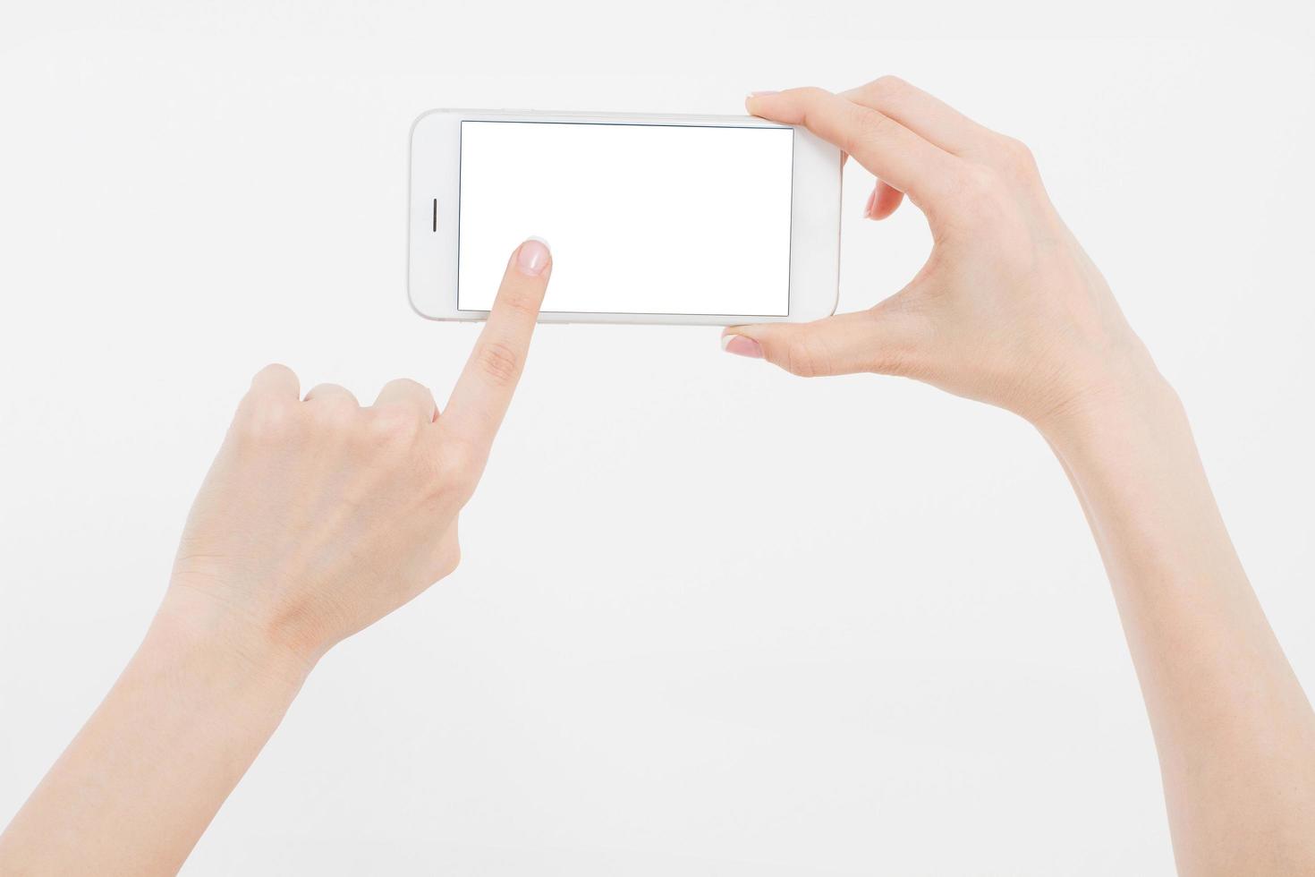 Hand holding white cellphone isolated on white clipping path inside. Online shopping. Top view. Mock up. Copy space. Template.Blank. photo