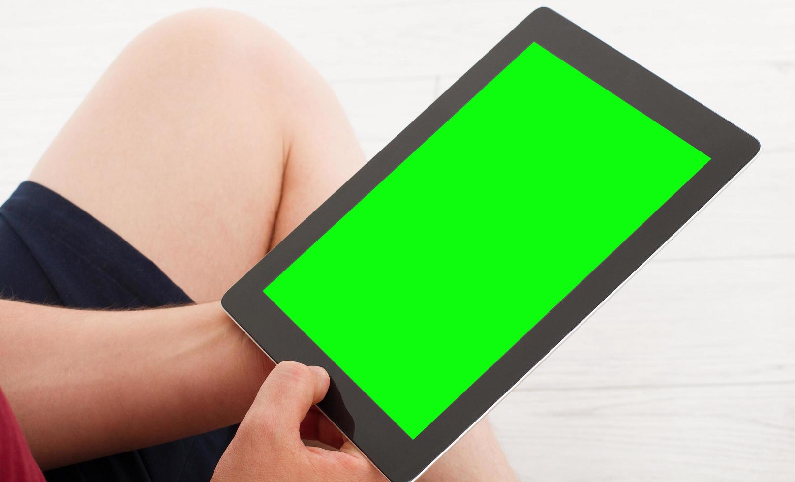 man using tablet with empty display - blank screen photo