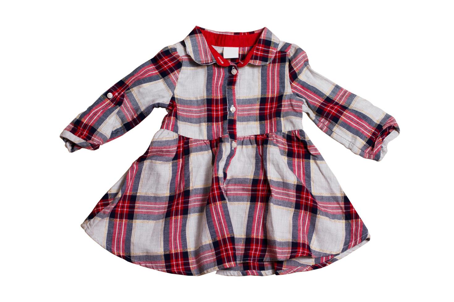 Children's checkered dress isolated on white background, clipping path of the child dress photo