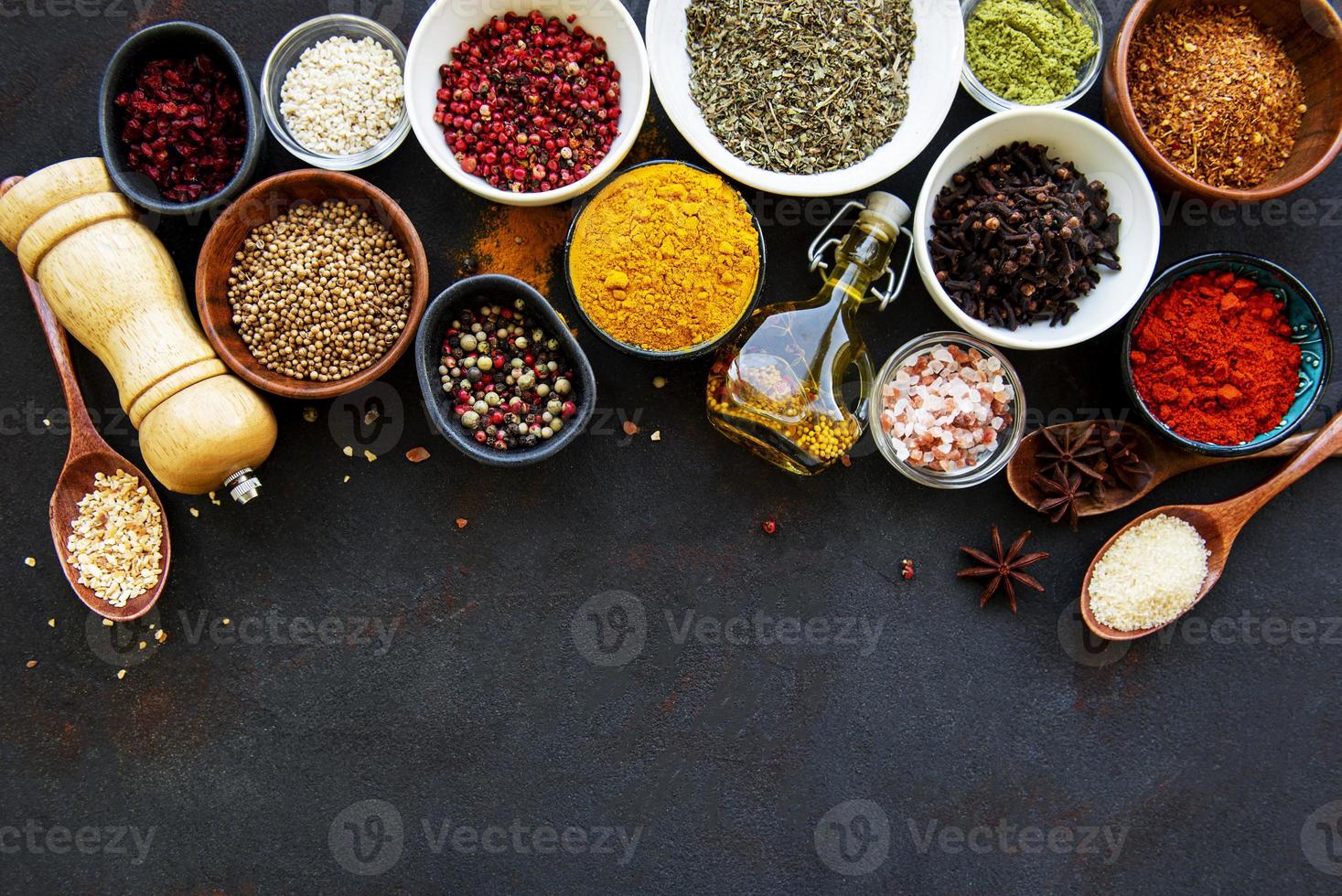 Assortment of spices on black photo