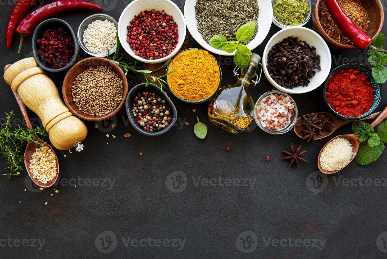 Various spices in a bowls on a black photo