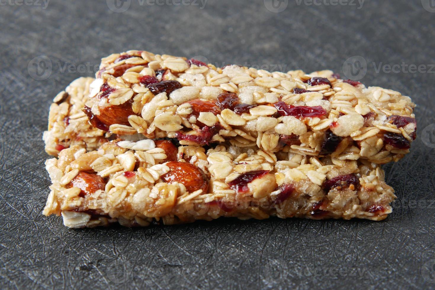 Almond , Raisin and oat protein bars on table photo