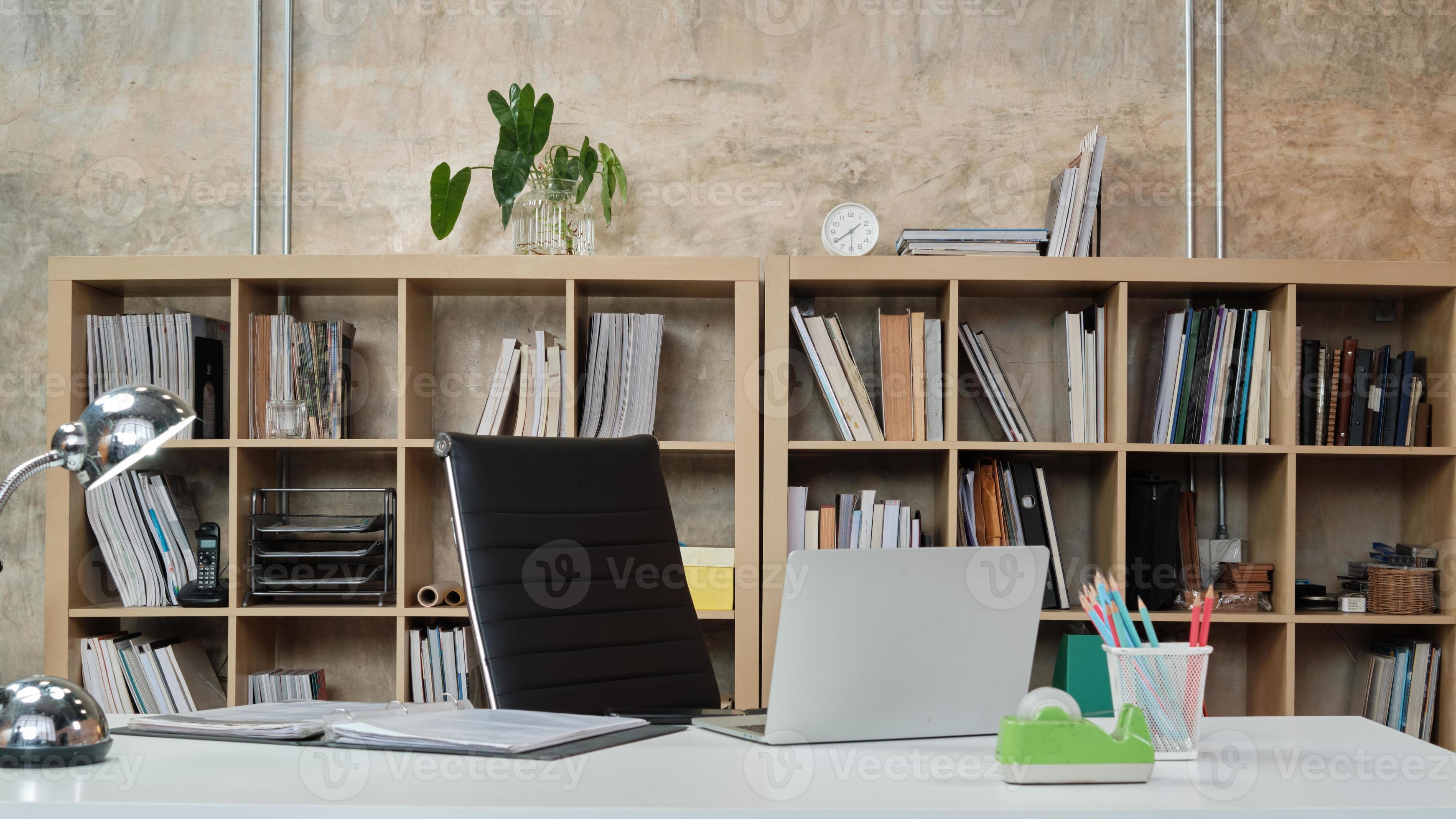 No people in a casual workplace, desk, and president chair in ...