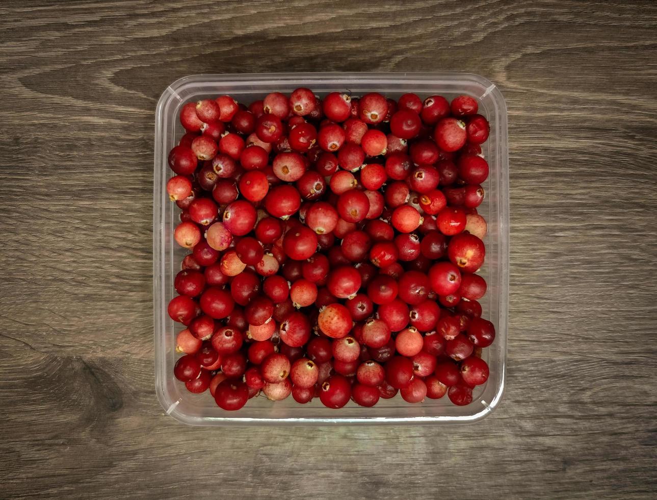 Cranberries in a jar on the table photo