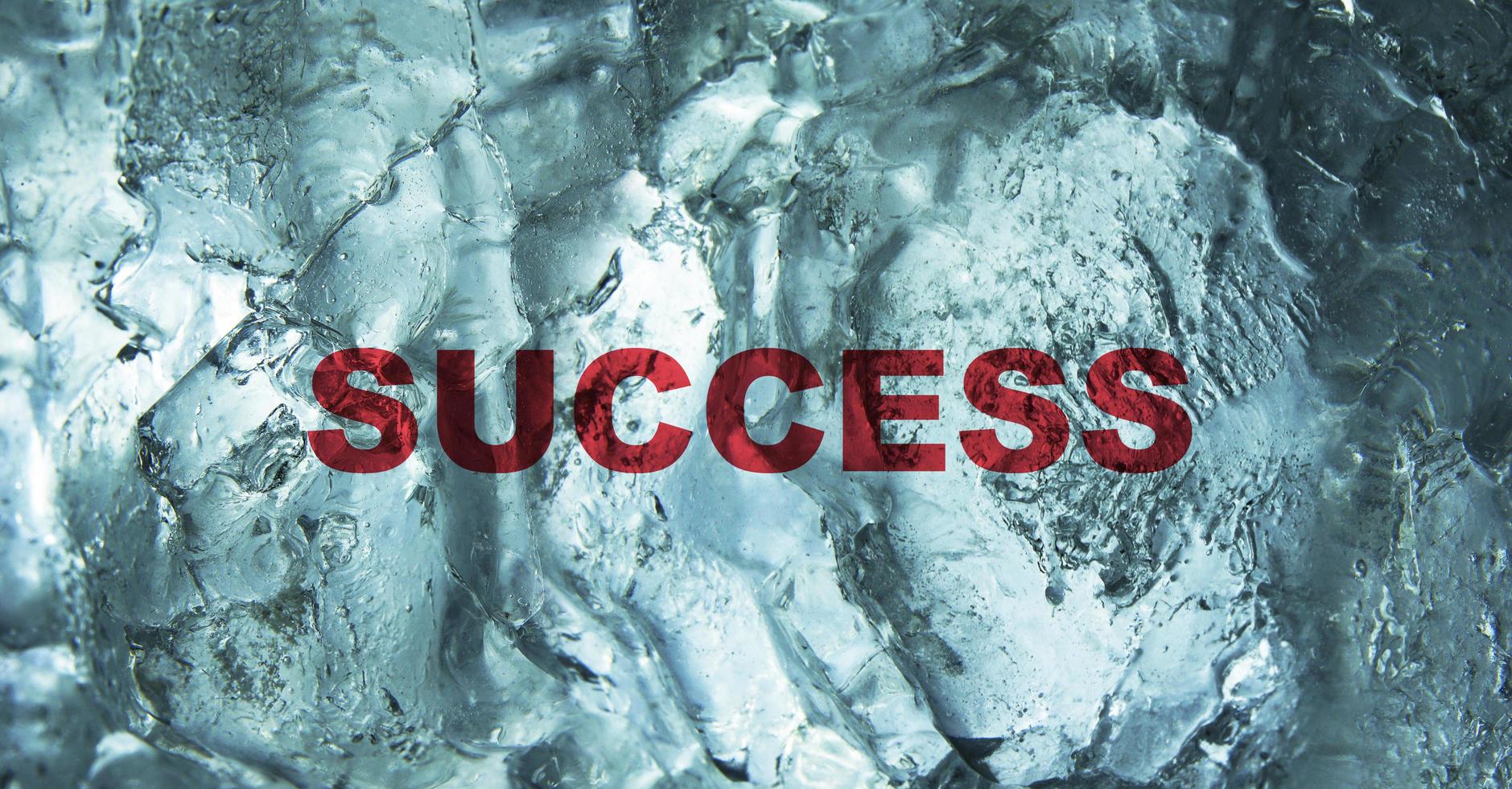 The Success word behind the ice wall background. Bussiness concept. photo