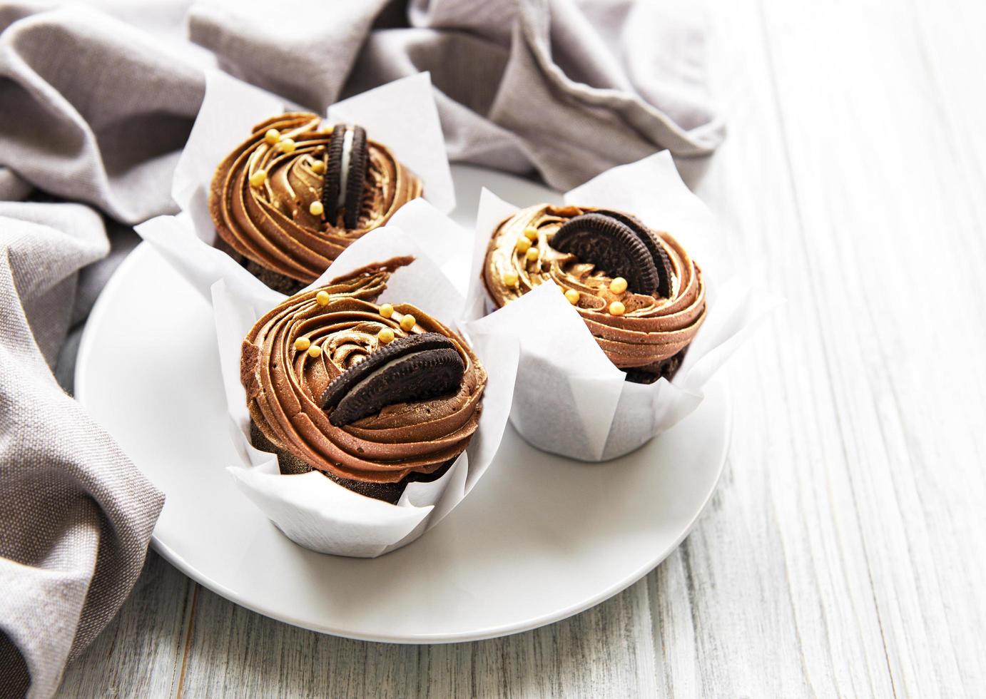 Chocolate cupcakes on plate photo