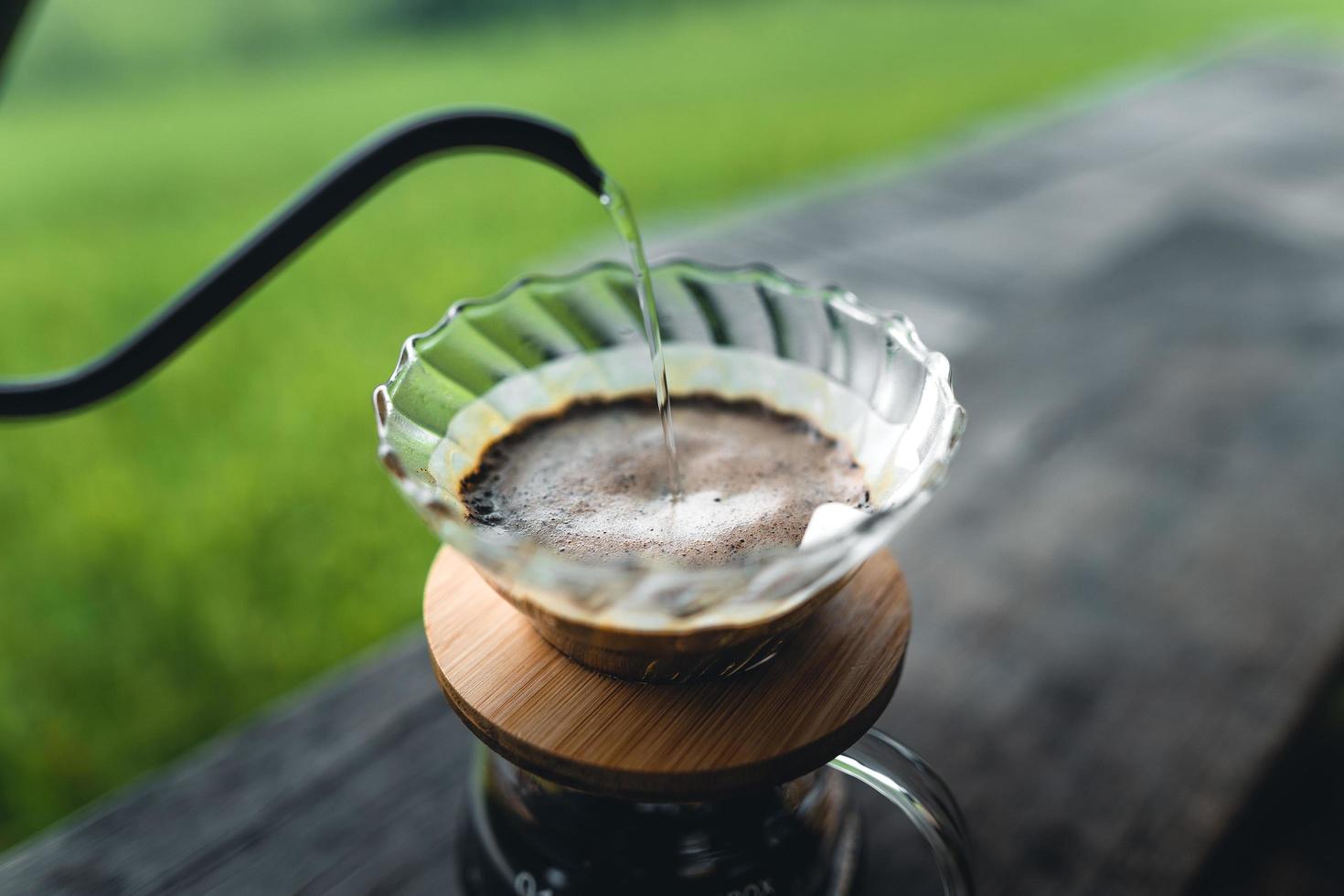 drip coffee maker on wooden table photo