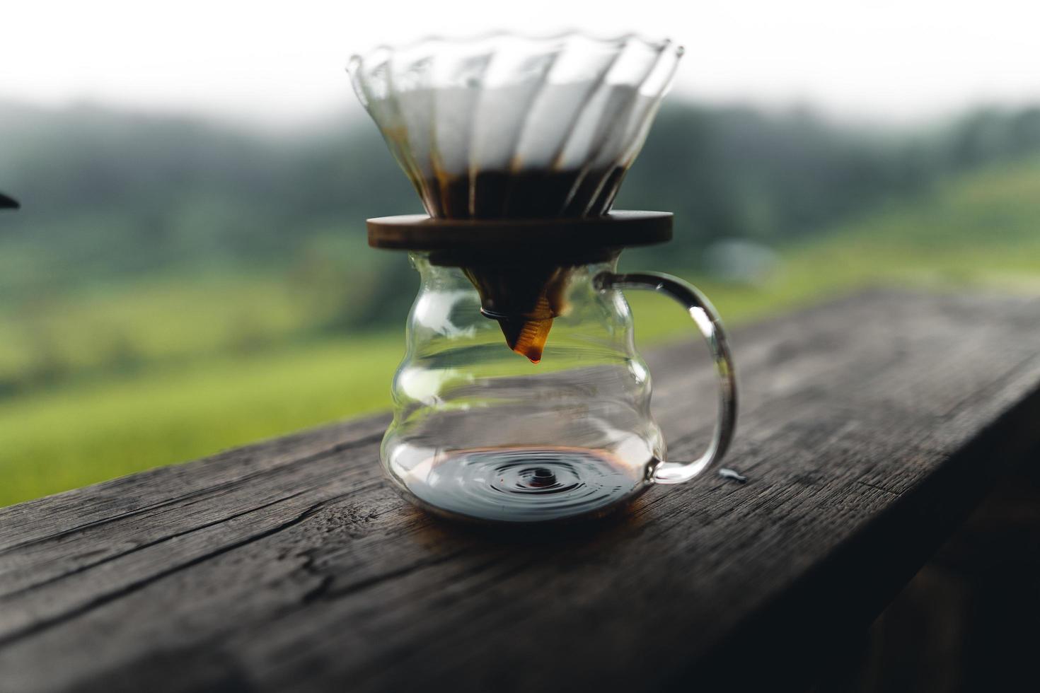 drip coffee maker on wooden table photo