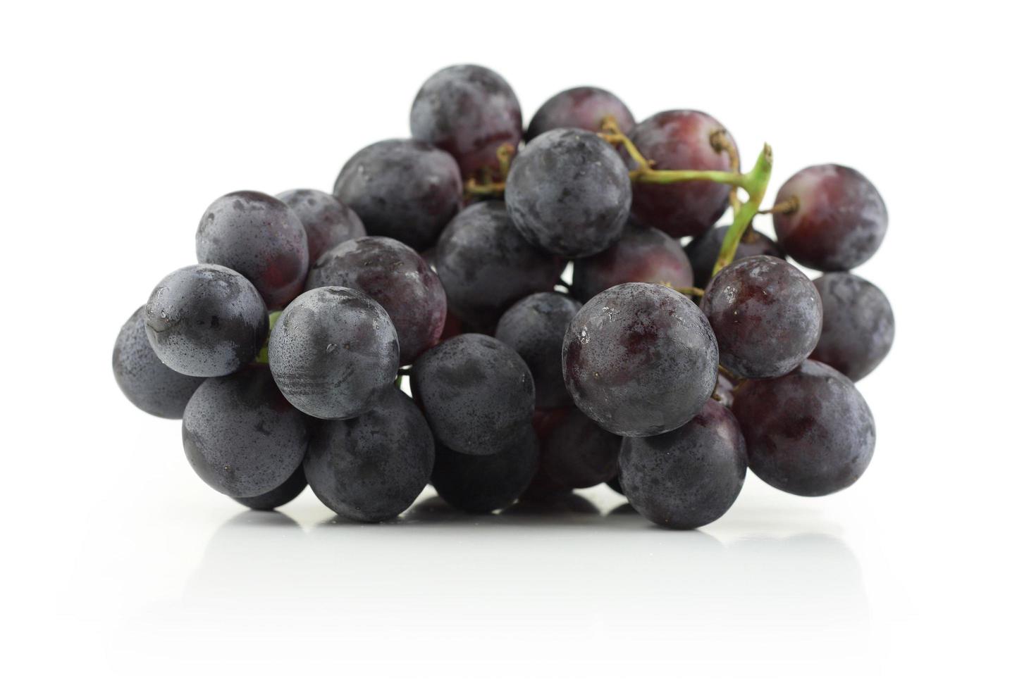 Grape cluster on white photo