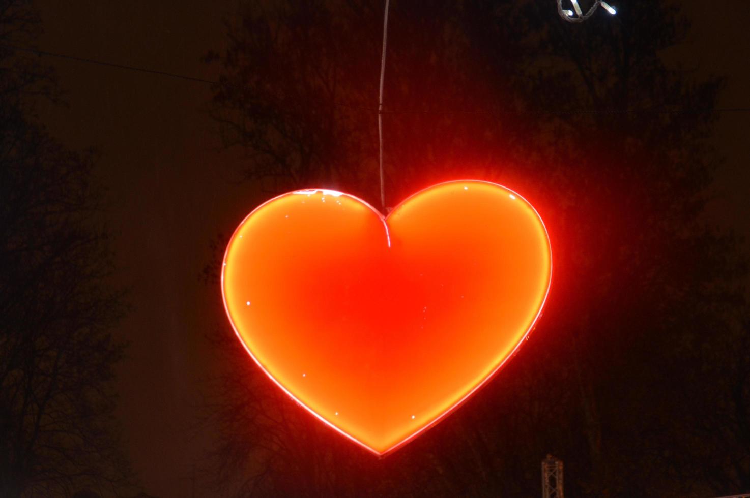 New Year's garland of hearts with illumination at night photo