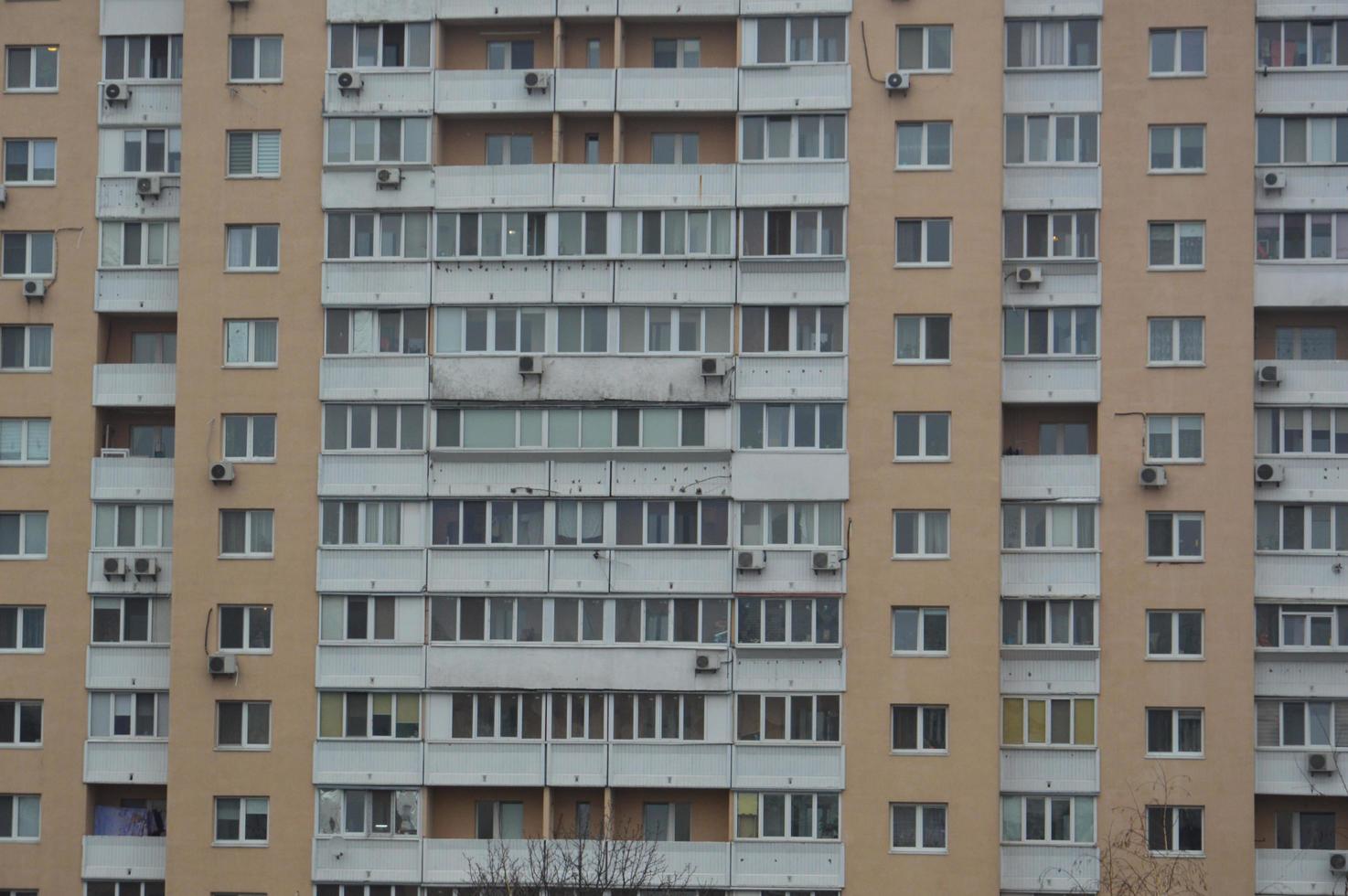 Panorama of the facades of residential multi-storey apartment buildings in the city photo