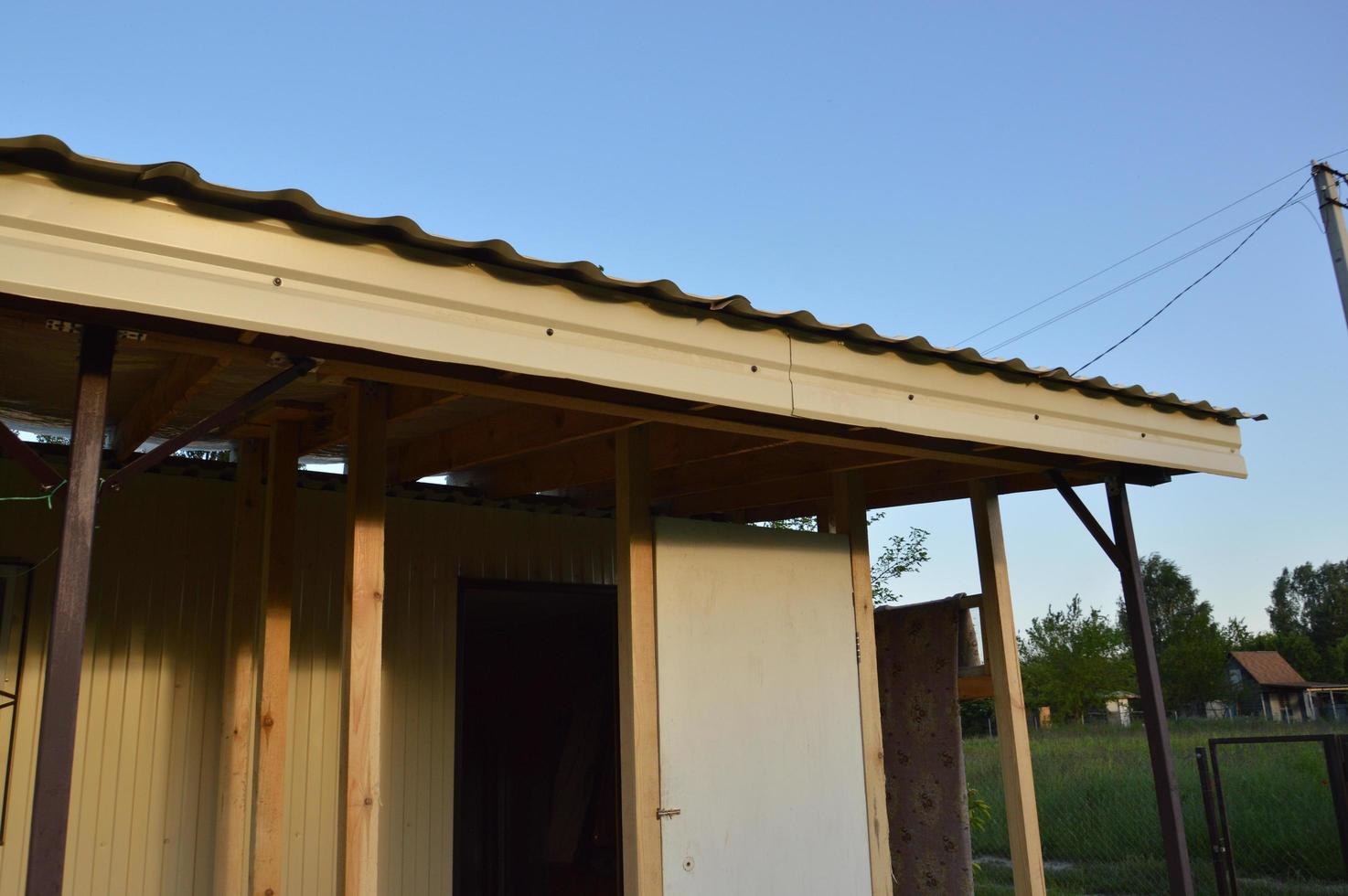 Construction of the vestibule of the veranda of racks and beams photo