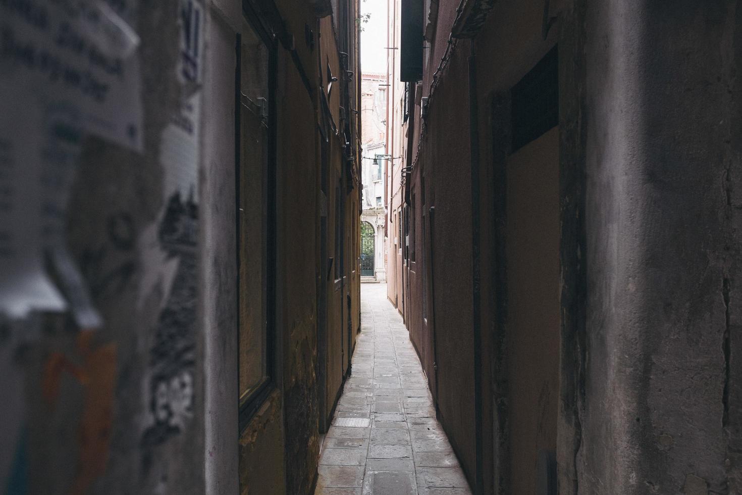 narrow alley in venice, italy photo