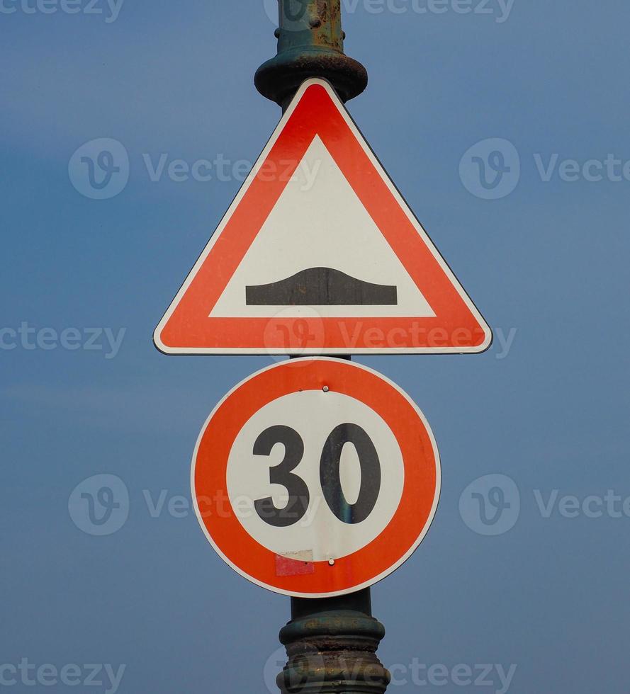 speed bump hump sign photo