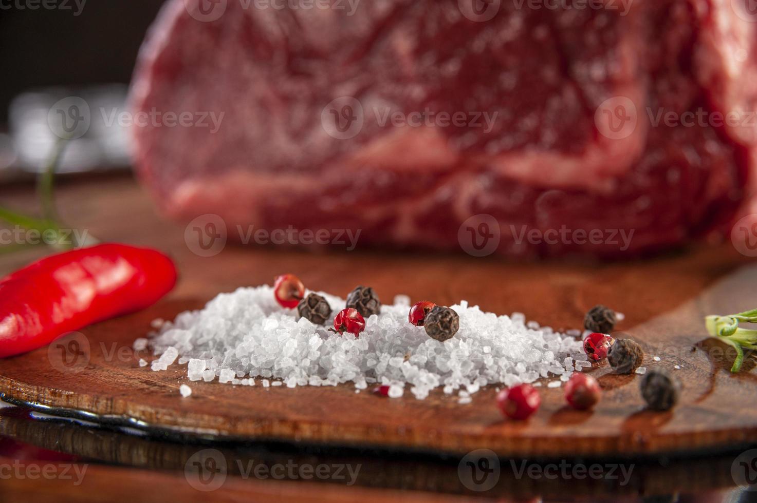 Parrilla salt and spices on wood cutting board Closeup. photo