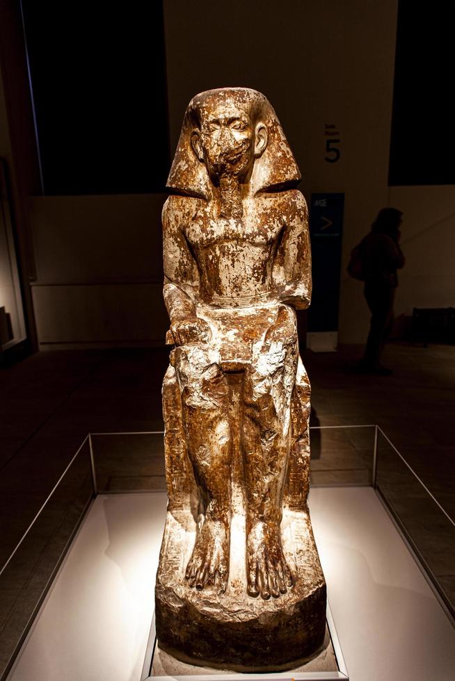 TURIN, ITALY, JUNE 3, 2015 - Statue of governor Wakha, son of Neferhotep in Museo Egizio in Turin, Italy. Museum houses one of largest collections of Egyptian antiquities more than 30,000 artefacts. photo