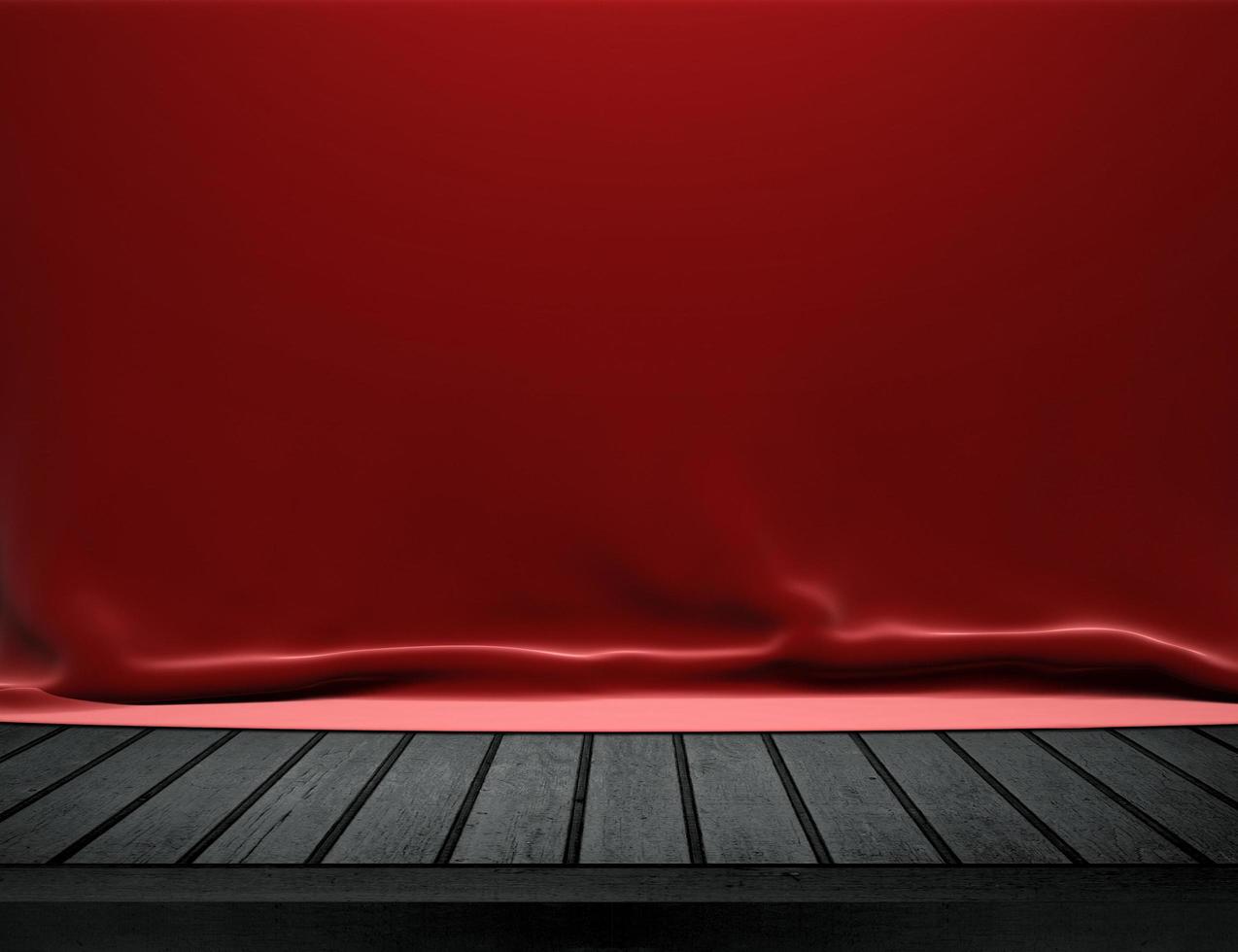 Mesa de madera con fondo de tela de terciopelo rojo foto