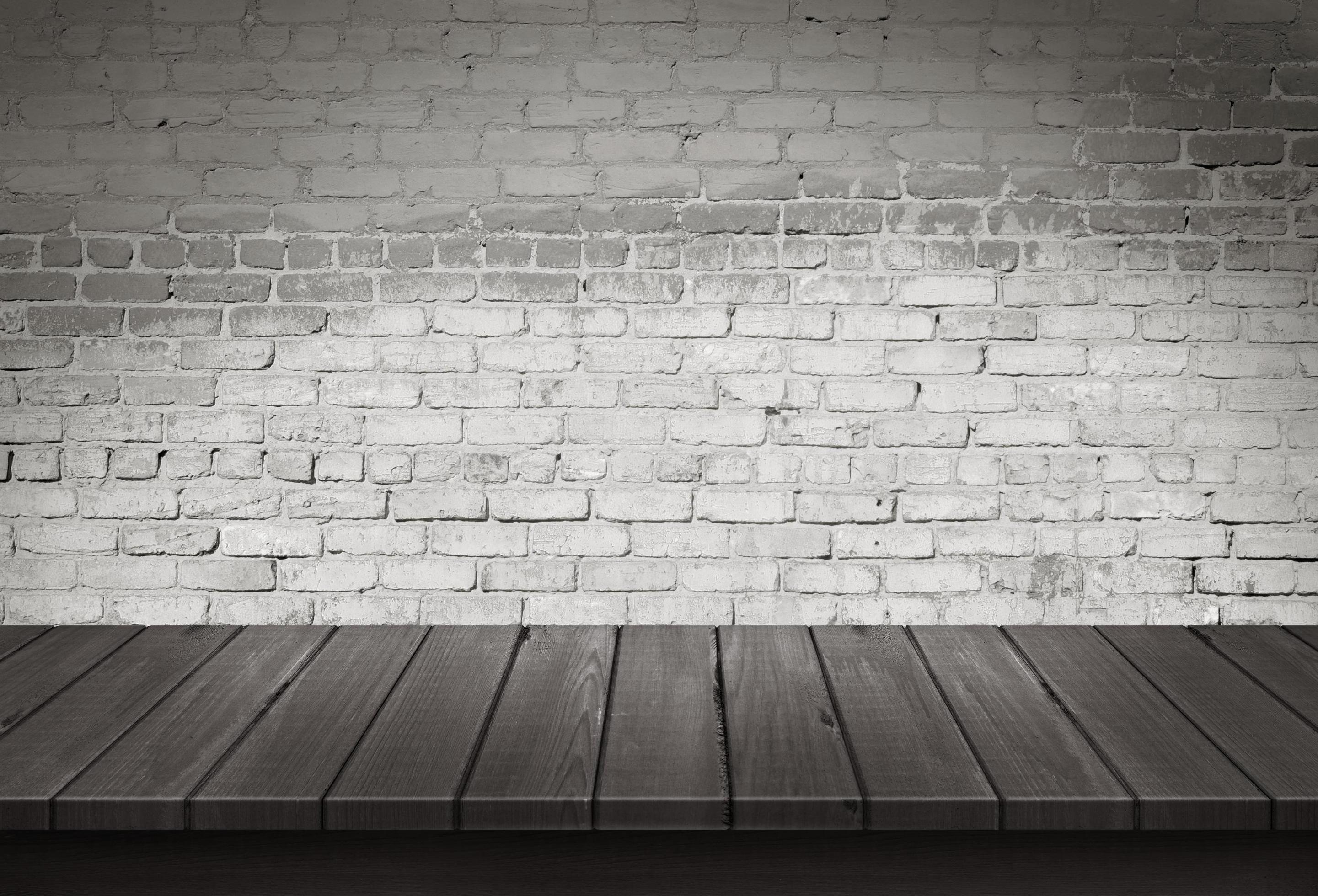 Wood table with White brick wall background 3742646 Stock Photo at Vecteezy