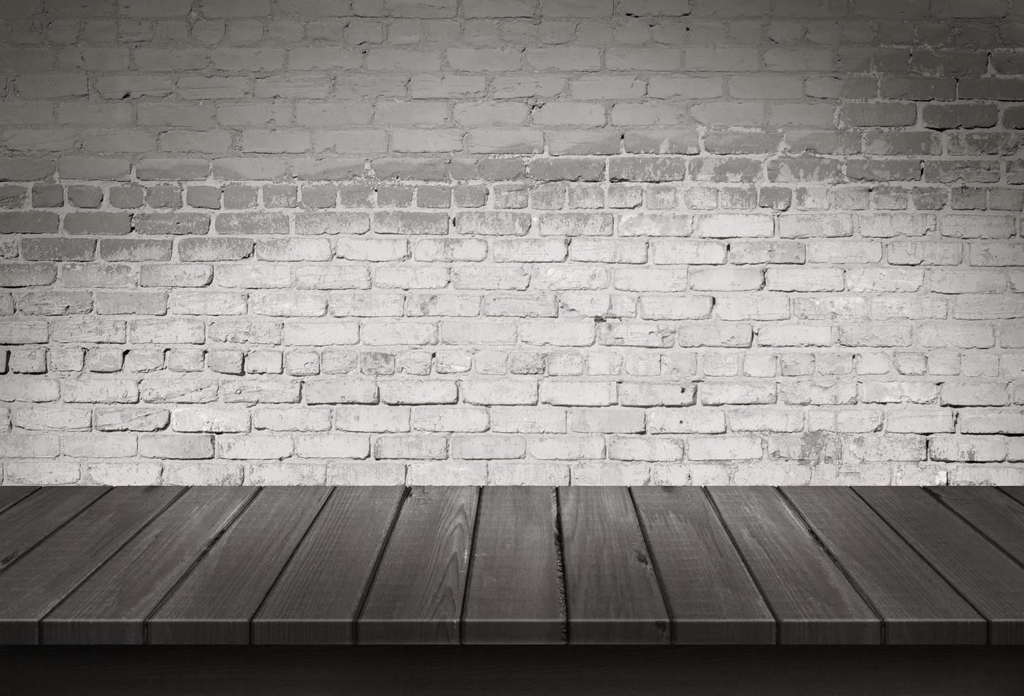 Wood table with White brick wall background photo