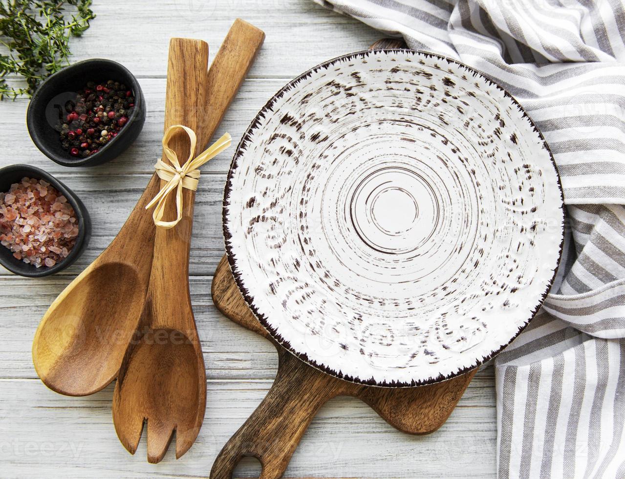 Empty plate on a wooden table photo