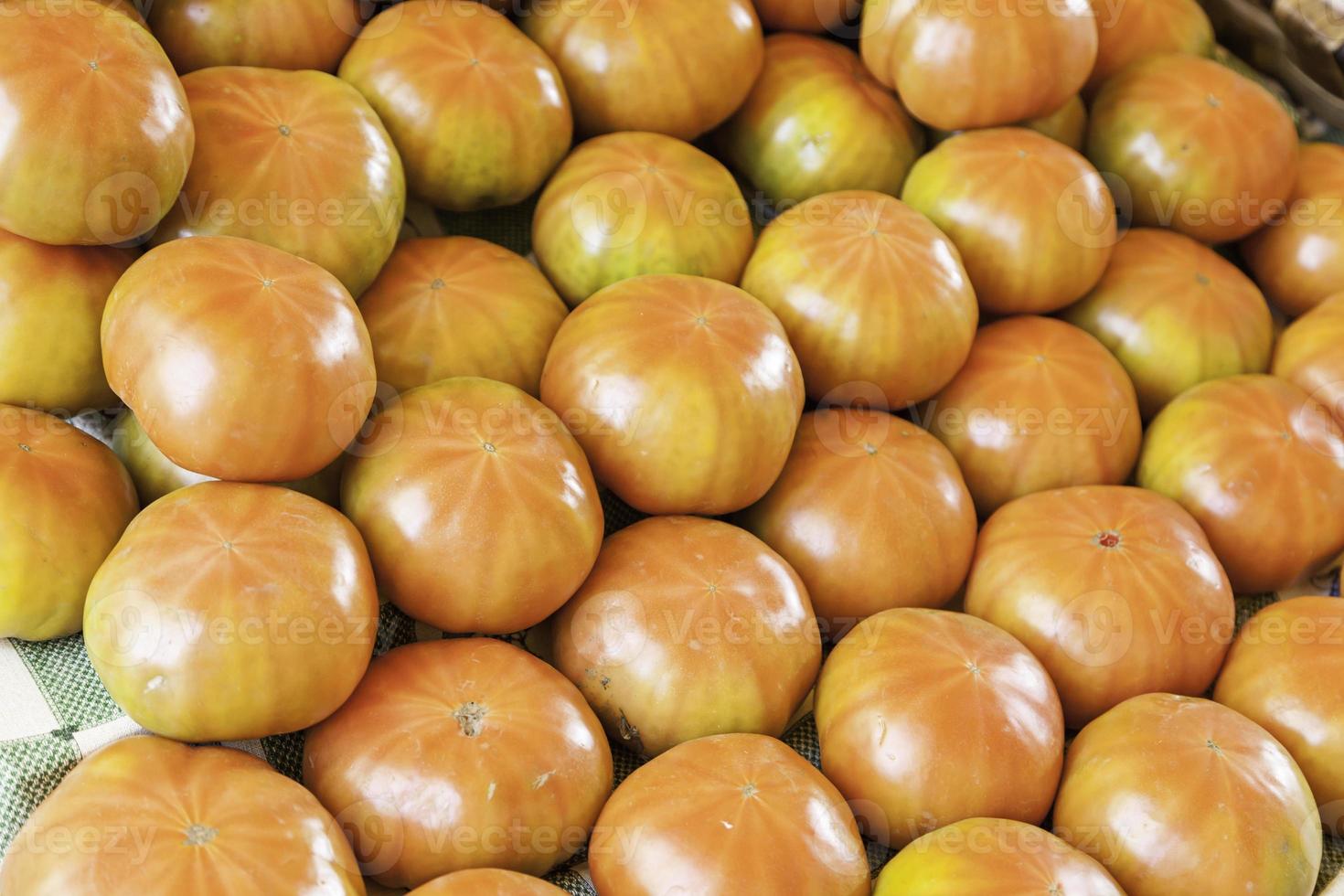 Fresh tomatoes on a market photo