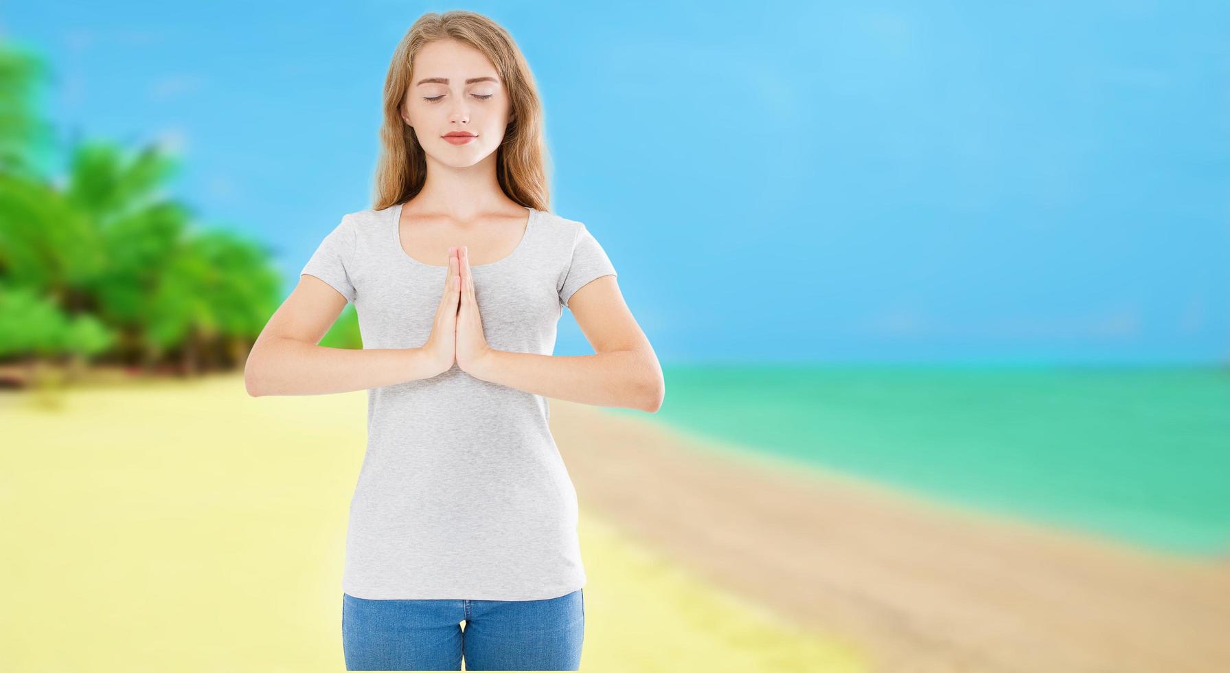 Smile Woman With Closed Eyes In Namaste Pose On Tropical Beach Ocean Sea Background - Summer Yoga Concept, copy space photo