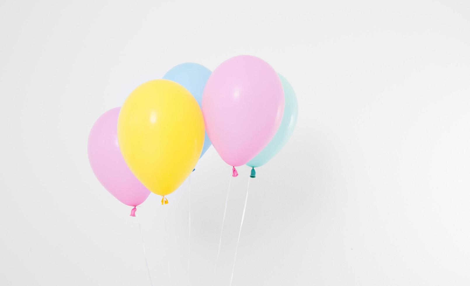 Colorful party balloons background. Isolated on white. Copy space photo