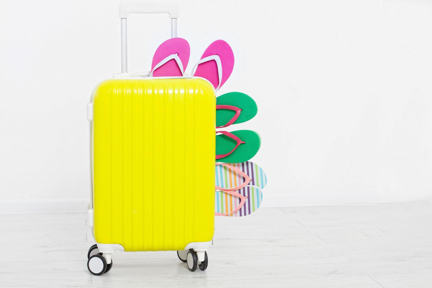 suitcase isolated on white background Summer holidays. summer flip flops or slippers.Sandals beach.Red cap.Travel valise or bag. Mock up. Copy space. Template. Blank. photo