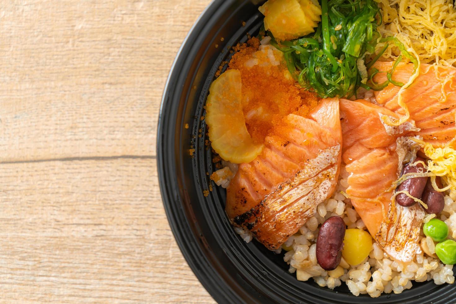 grilled salmon with brown rice donburi photo