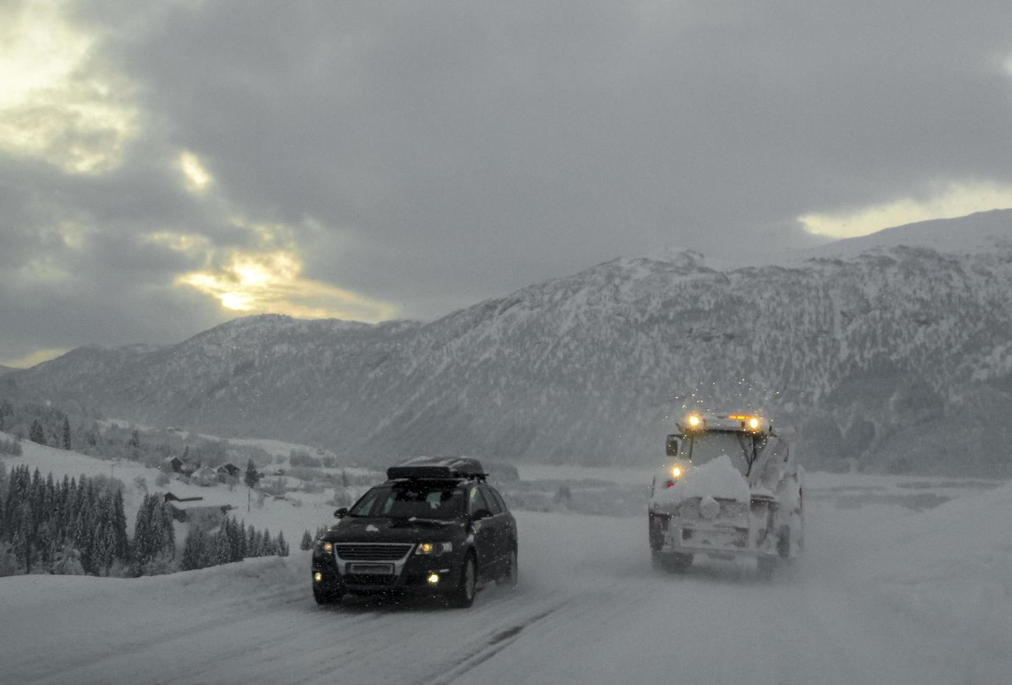 Driving through snowy road and landscape in Norway. photo