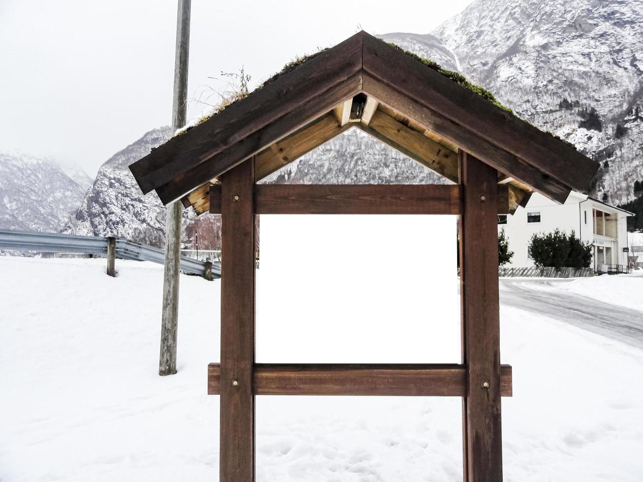 Empty wooden tourist information sign in winter in Norway. photo