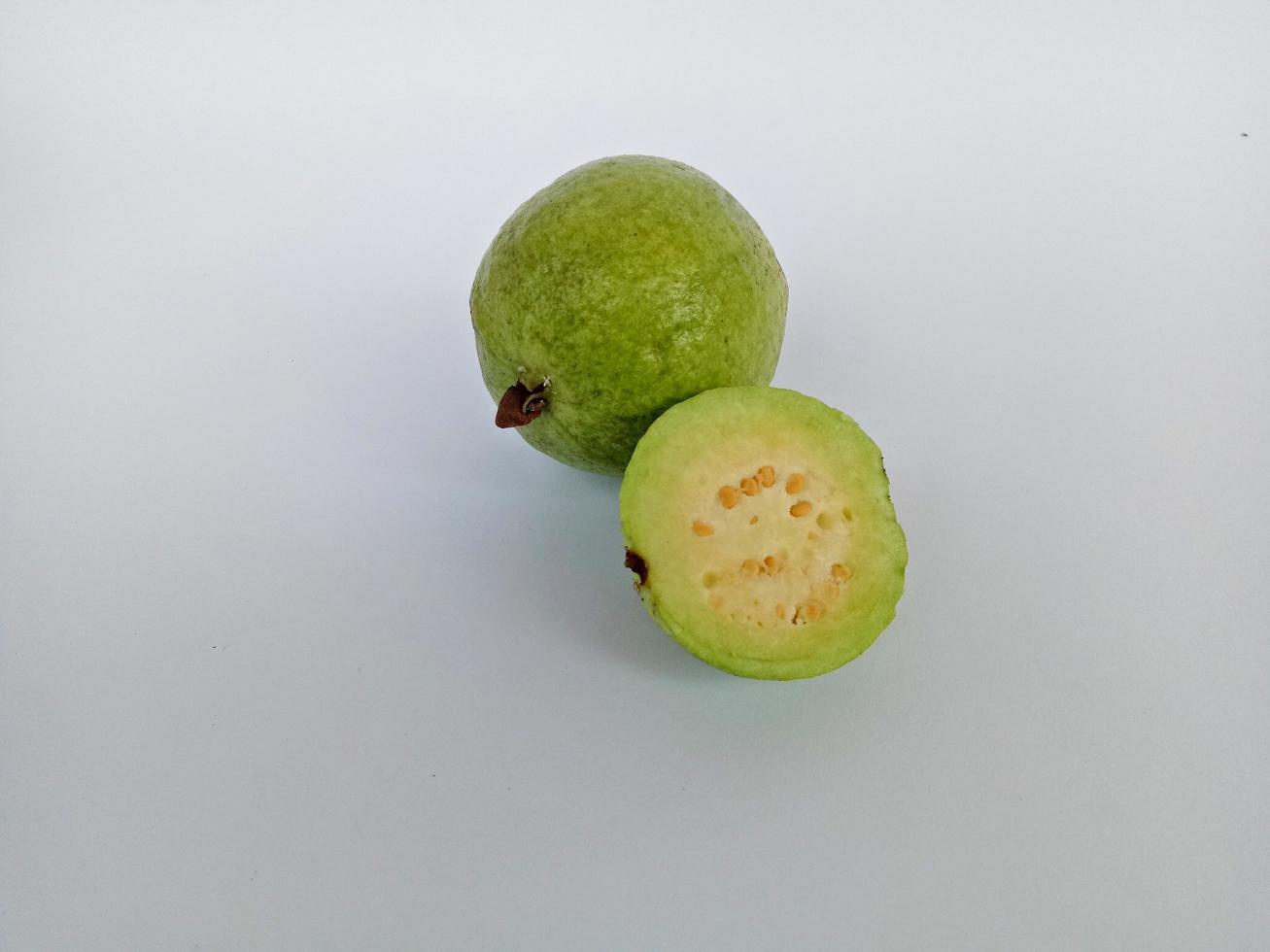 Some guavas isolated on white background photo