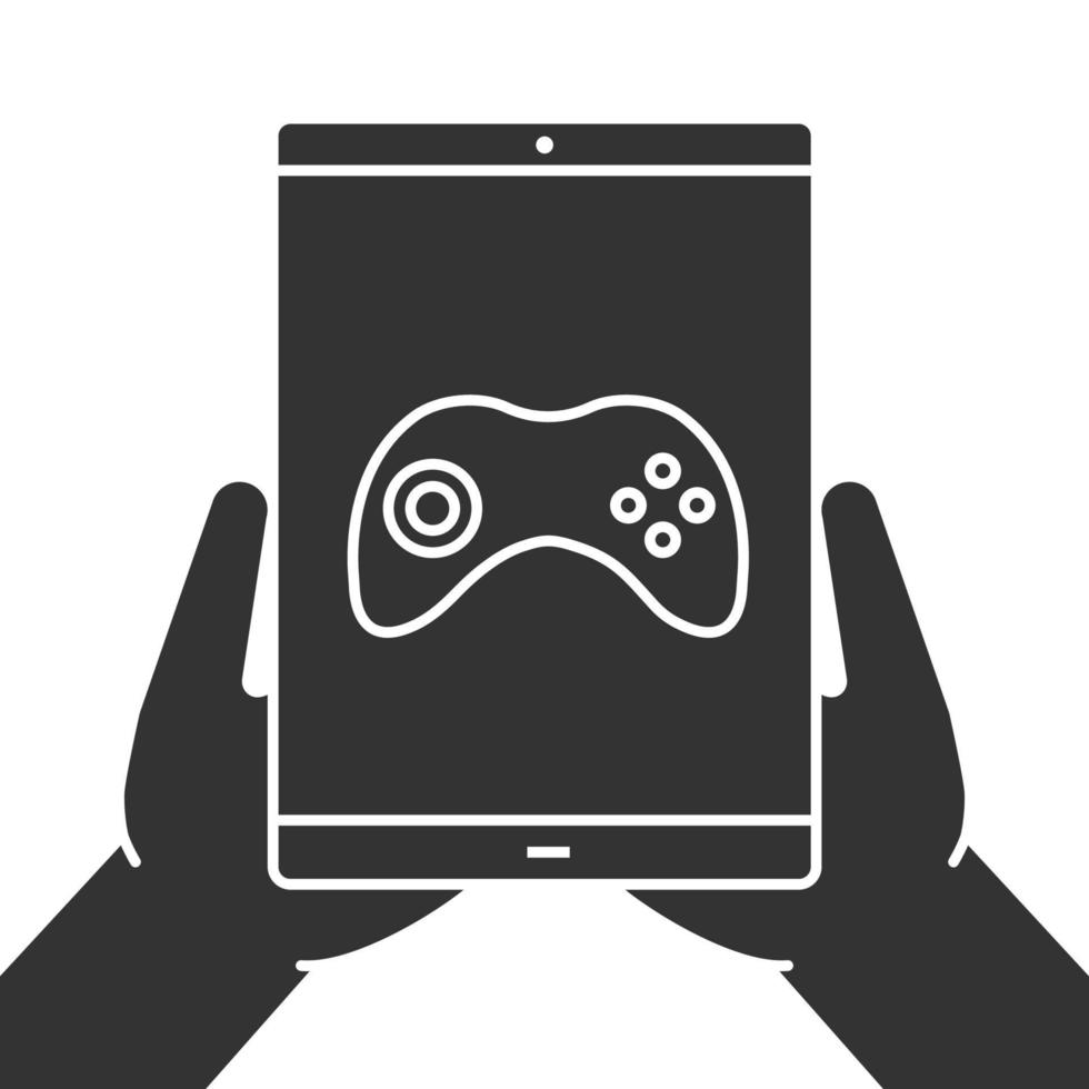 Hands holding tablet computer glyph icon. Silhouette symbol. Tablet computer with gamepad. Negative space. Vector isolated illustration