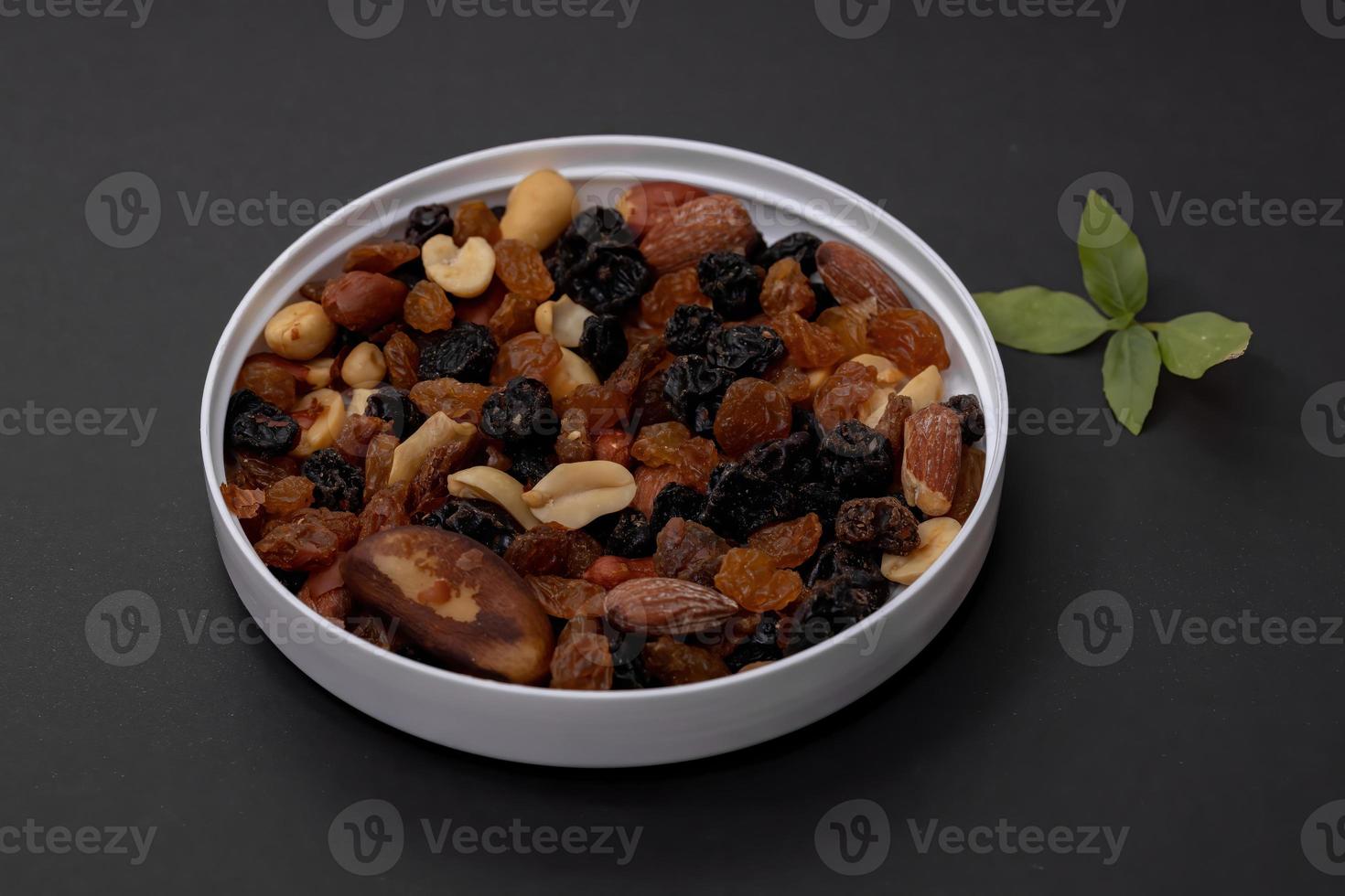 Mix of nuts with dried fruits photo