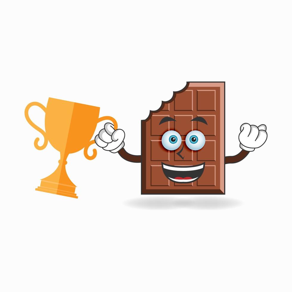 Personaje de mascota de chocolate con un trofeo en la mano derecha. ilustración vectorial vector