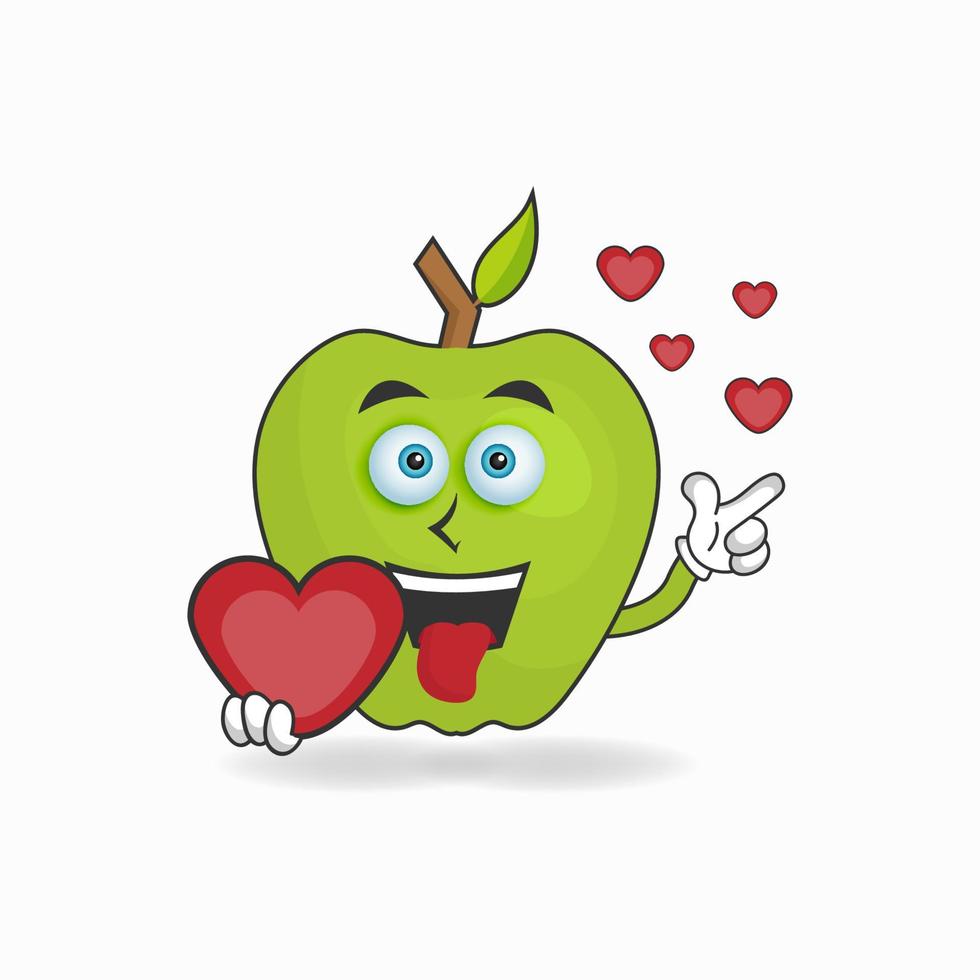 personaje de mascota de manzana sosteniendo un icono de amor. ilustración vectorial vector