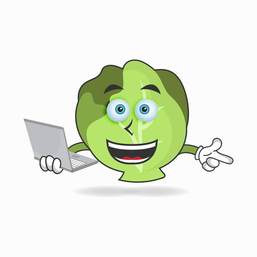 Personaje de mascota de repollo con laptop en mano derecha. ilustración vectorial vector