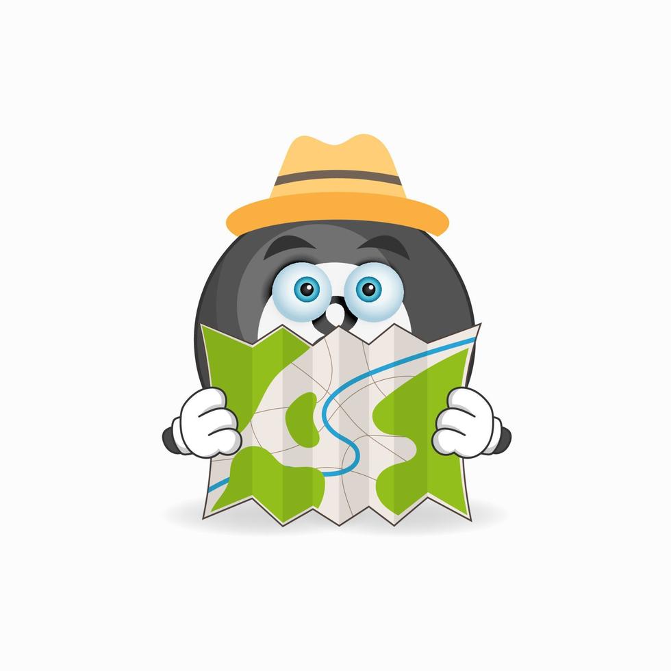 The Billiard ball mascot character holds a map. vector illustration