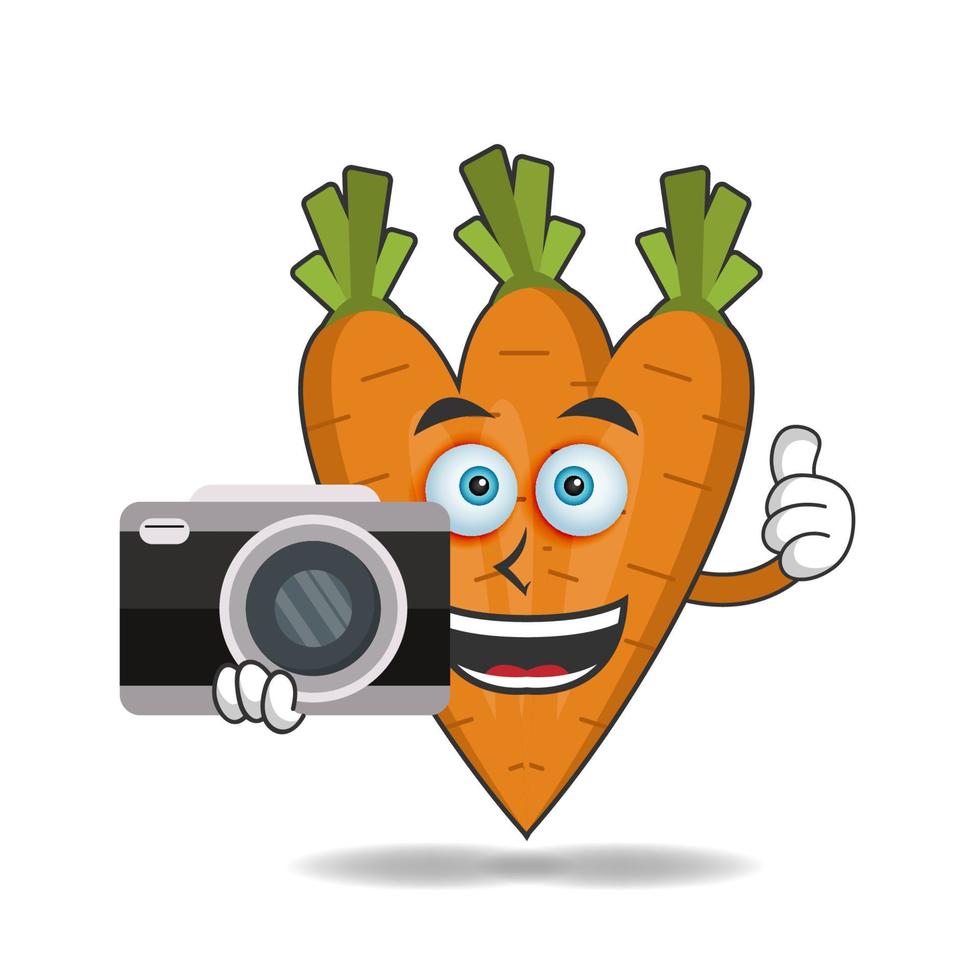 Carrot mascot character holding camera. vector illustration