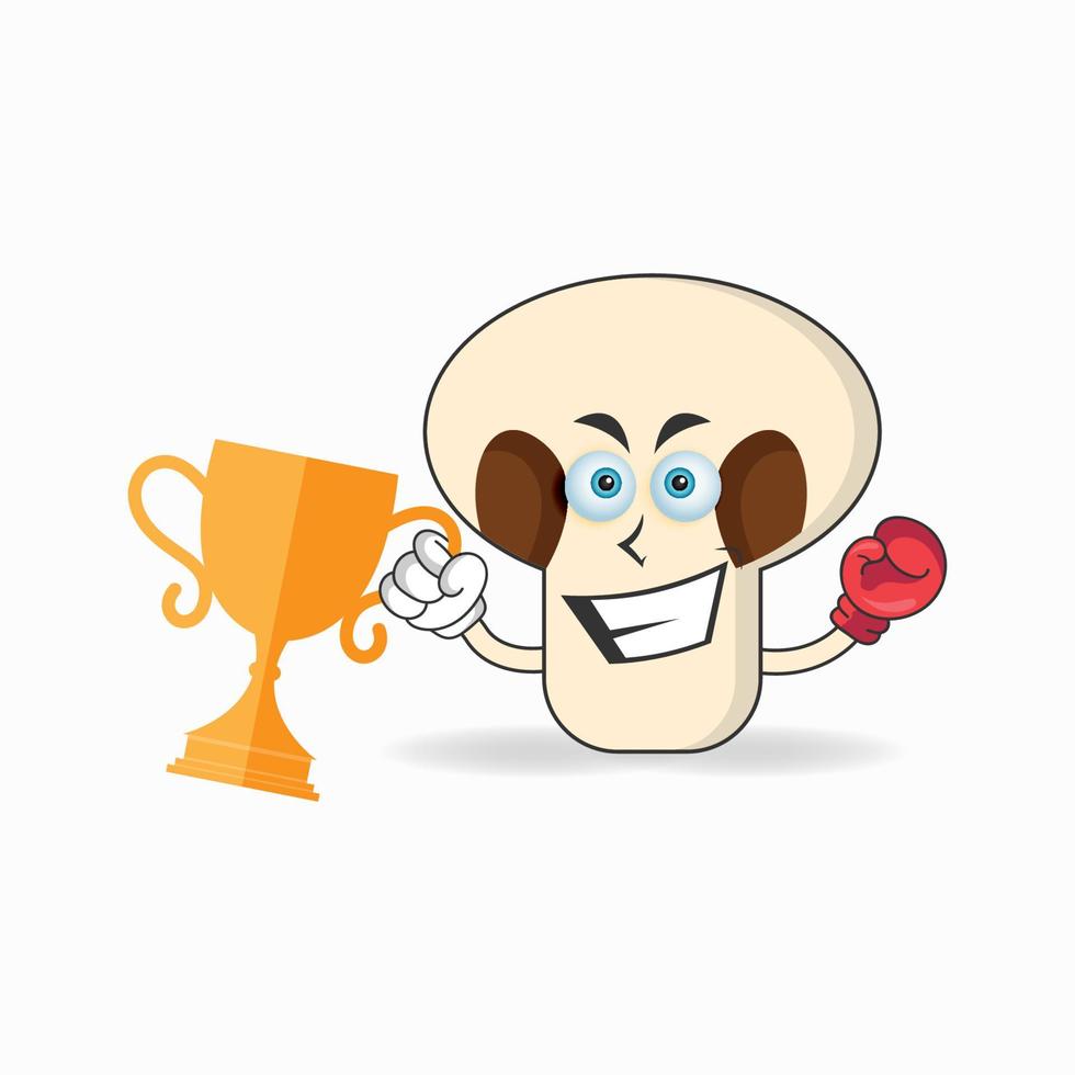 The mushrooms mascot character wins a boxing trophy. vector illustration