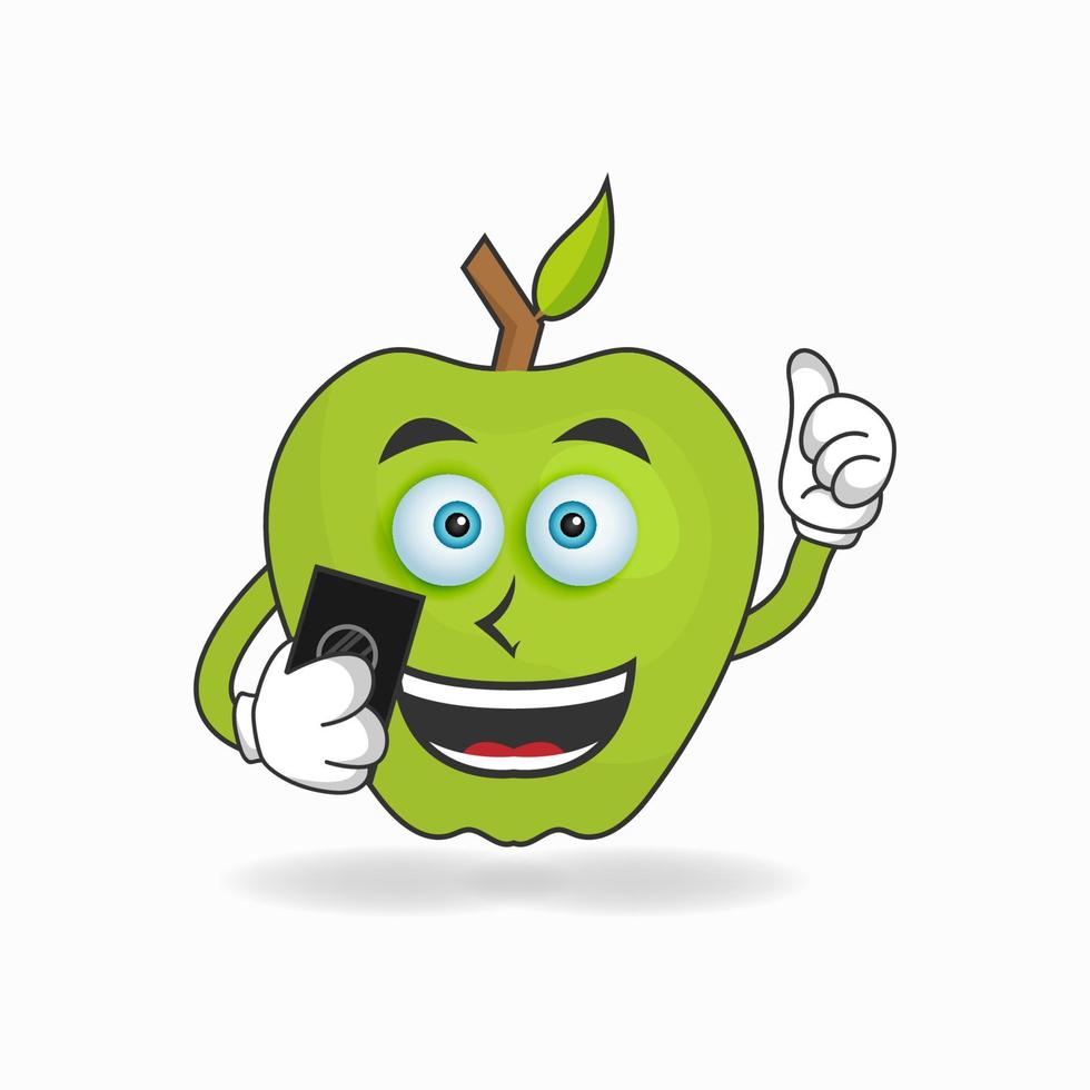 personaje de mascota de manzana sosteniendo un teléfono celular. ilustración vectorial vector