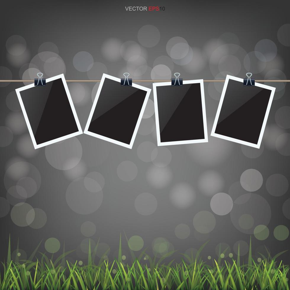 Blank photo frame in grass field with light blurred bokeh background. Vector. vector