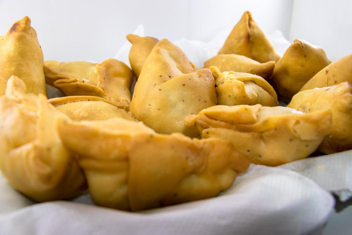 Vegetarian samosas filled with potato and green pea.Indian special traditional street food photo