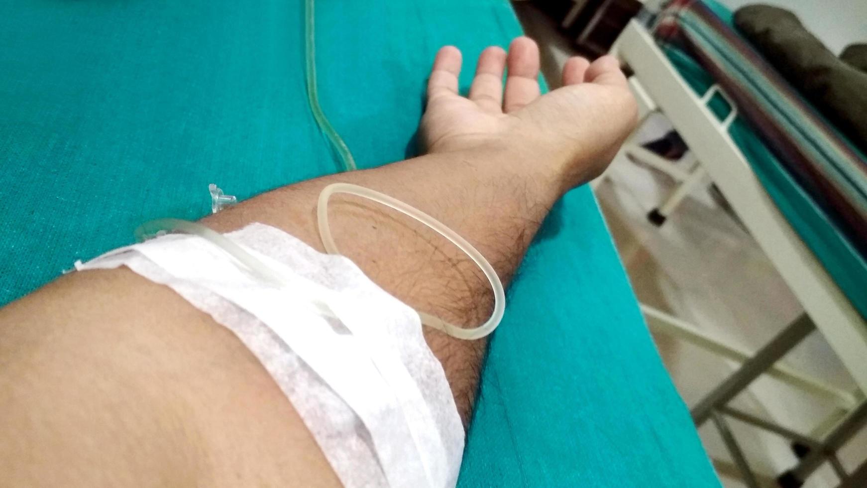 Close up image of IV drip in patient's hand in hospital. photo