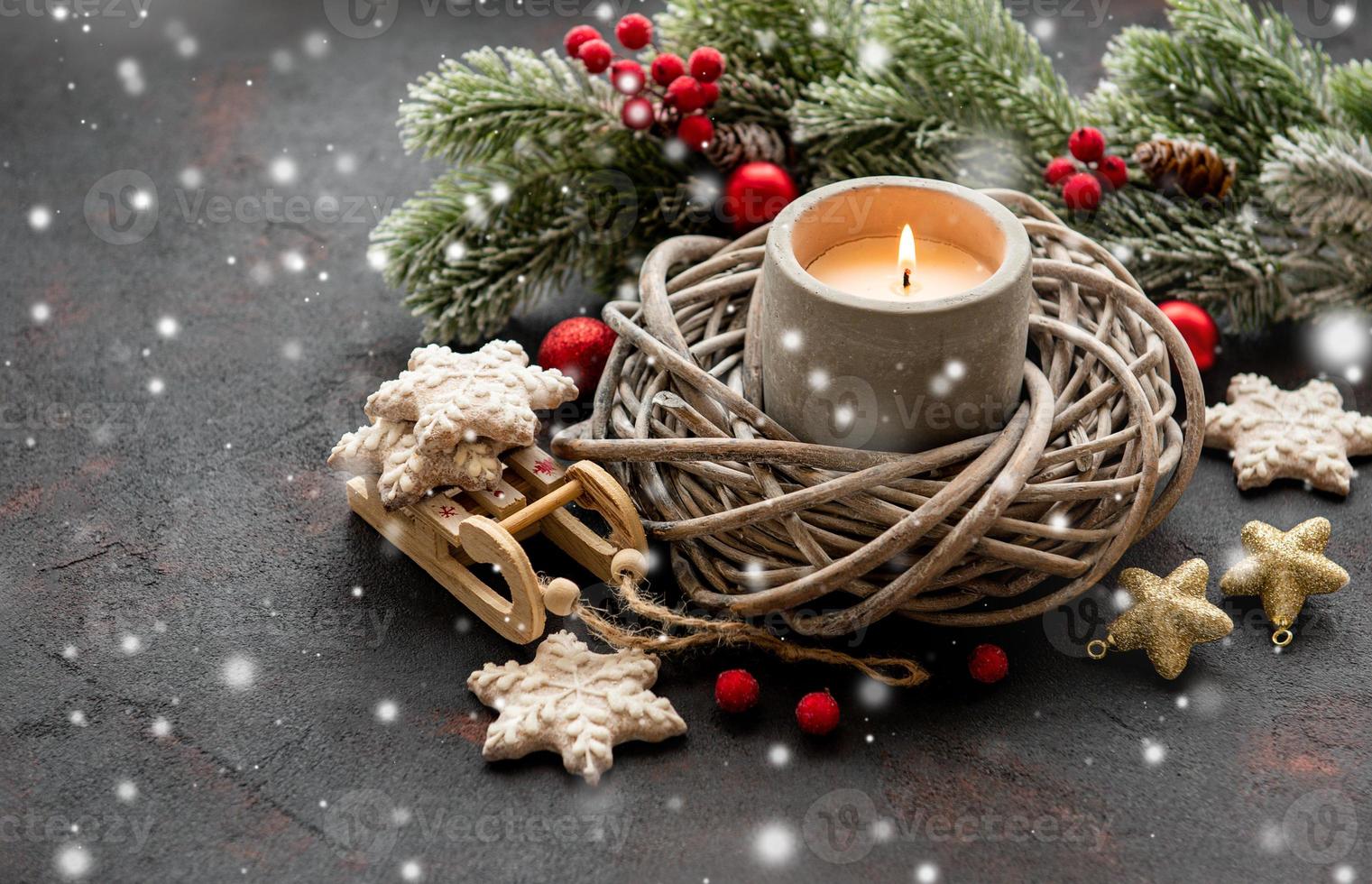 Candle and Christmas decorations photo
