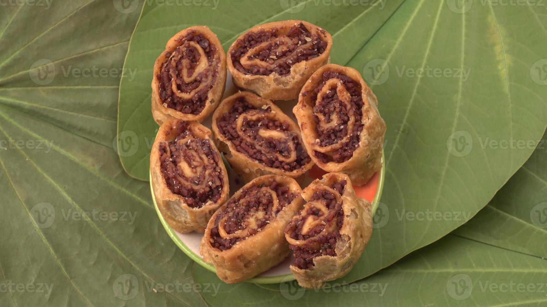 Indian traditional Snacks Bhakarvadi or Bakarvadi.Diwali snacks Bhakarwadi, selective focus photo