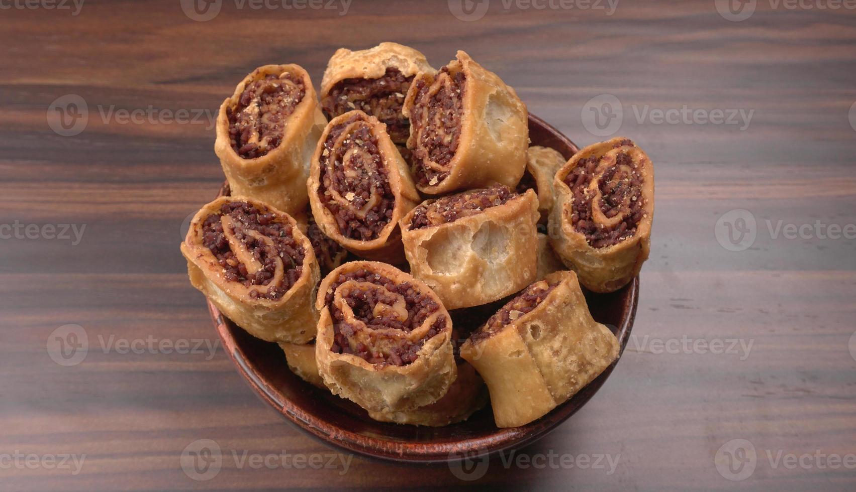 Indian traditional Snacks Bhakarvadi or Bakarvadi.Diwali snacks Bhakarwadi, selective focus photo
