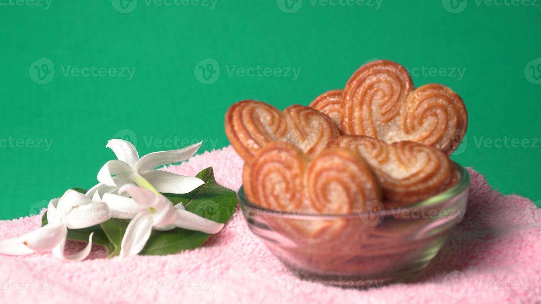 Delicious homemade heart shaped cookie on a color background. Top View. Place for text. photo