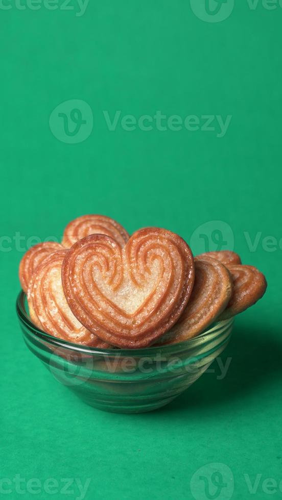 Delicious homemade heart shaped cookie on a color background. Top View. Place for text. photo